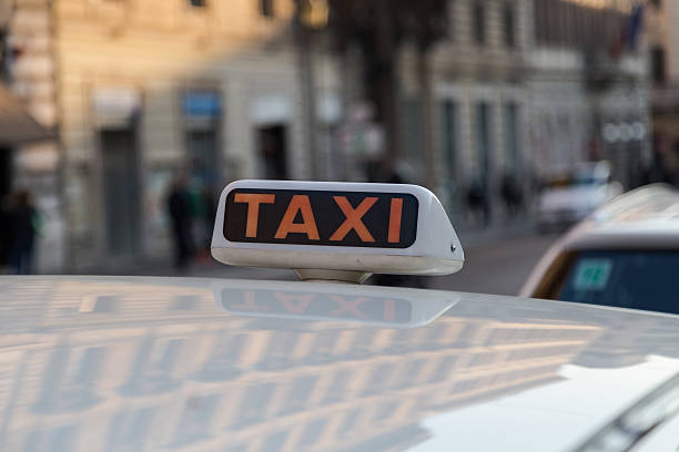 Taxi Sign on a Taxi in Rome