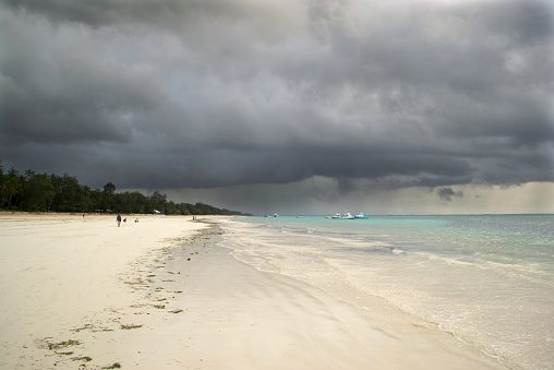 Storm gathering over a tropical beach