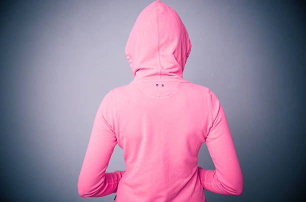 istock woman in pink jacket with hood 469924954