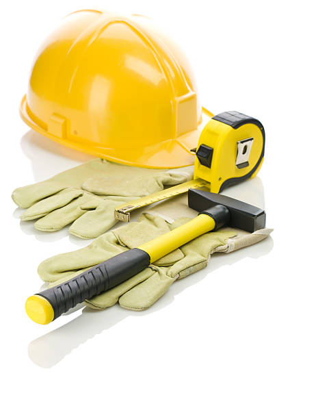istock gloves with hammer and helmet 469926358