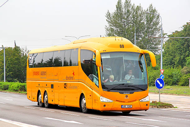 Irizar PB Brno, Czech Republic - July 22, 2014: Yellow interurban coach Irizar PB drives at the city street. park designer label stock pictures, royalty-free photos & images