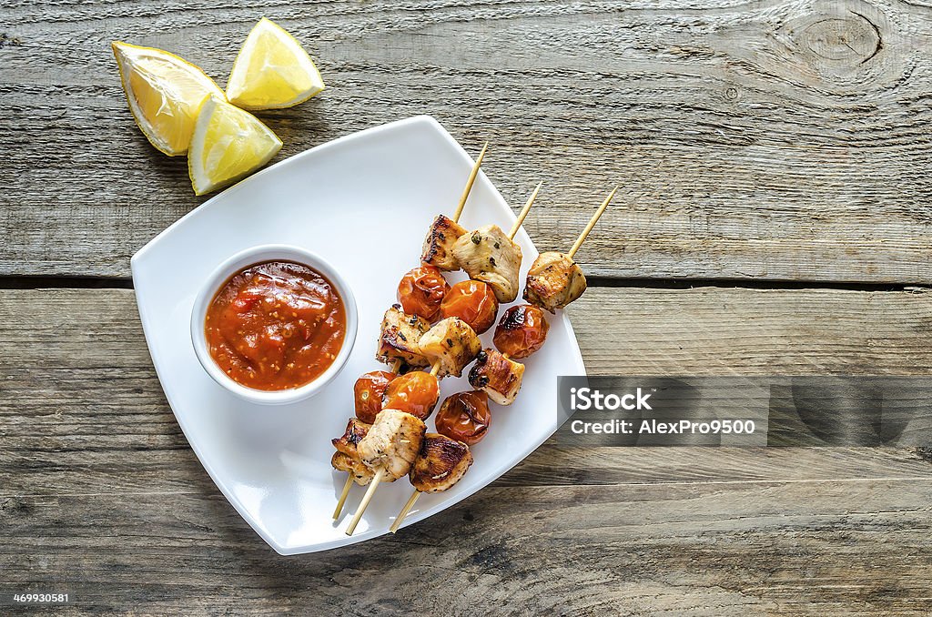 Grilled chicken skewers with cherry tomatoes Barbecue - Meal Stock Photo