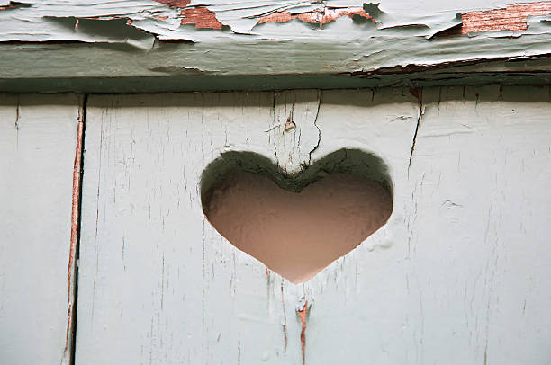 istock Part of an old window shutter with heart symbol 469931495