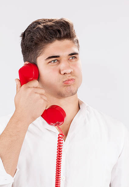 istock Young man and old  phone 469931912