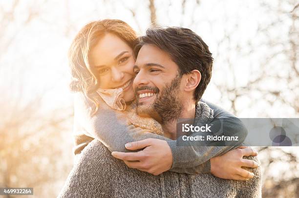Couple Piggyback Stock Photo - Download Image Now - Couple - Relationship, Happiness, Winter