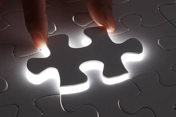 istock Hand holding the last piece of jigsaw puzzle 469932591