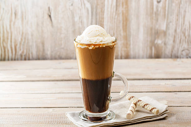 istock cold coffee with ice cream in a glass 469932760
