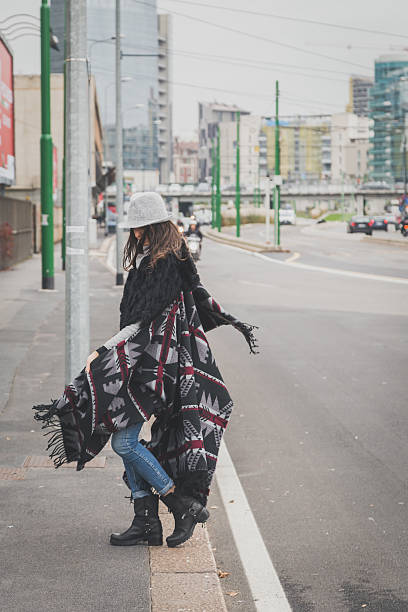 istock Beautiful young brunette posing in the city streets 469933100