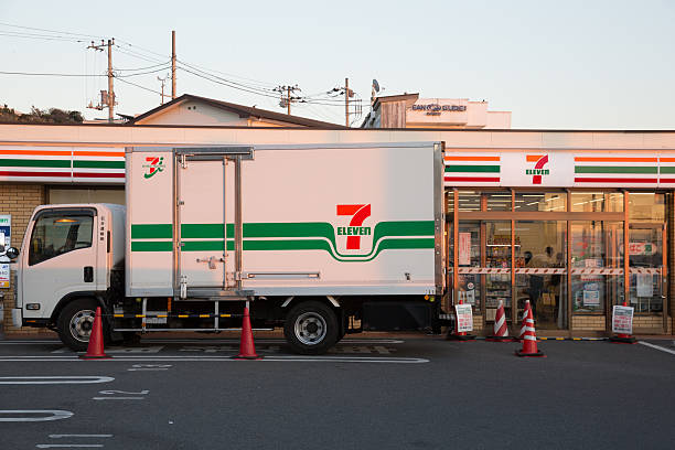 7-Eleven Convenience Store in Japan Fujisawa, Japan - November 23, 2013: 7-Eleven Convenience Store in Fujisawa, Kanagawa Prefecture, Japan. 7-Eleven is a international chain of convenience stores. Some customers are inside the convenience store. fujisawa kanagawa photos stock pictures, royalty-free photos & images