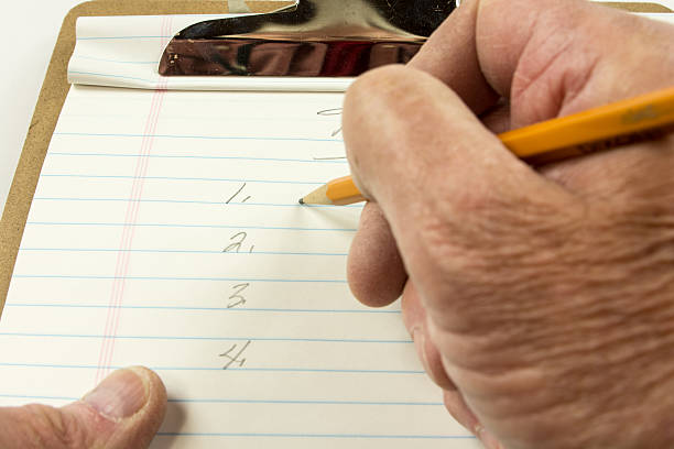 istock Individual's personal view  working on a list of objectives. 469938076