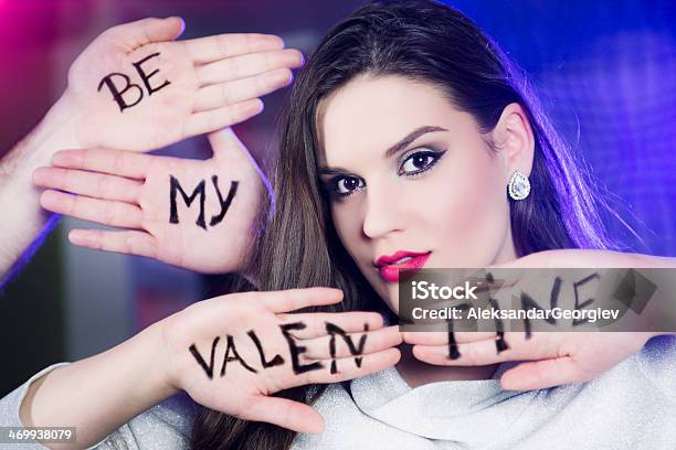 Beautiful Girl Ask Be My Valentine Written On Hands Stock Photo - Download Image Now