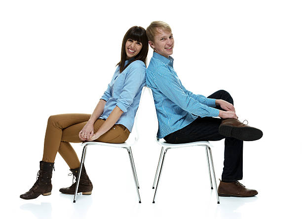 istock Smiling couple sitting on chair 469938093