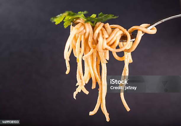 Noodles On Fork Studio Shot Stock Photo - Download Image Now - Asian Food, Basil, Black Color