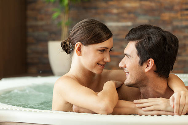 istock Couple in hot tub 469938165