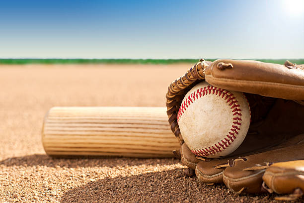 istock Baseball and glove on grass field 469938543