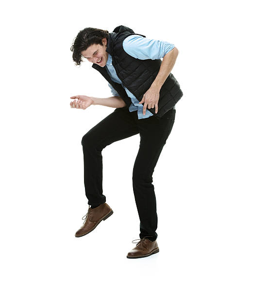 istock Smiling man on air guitar 469942173
