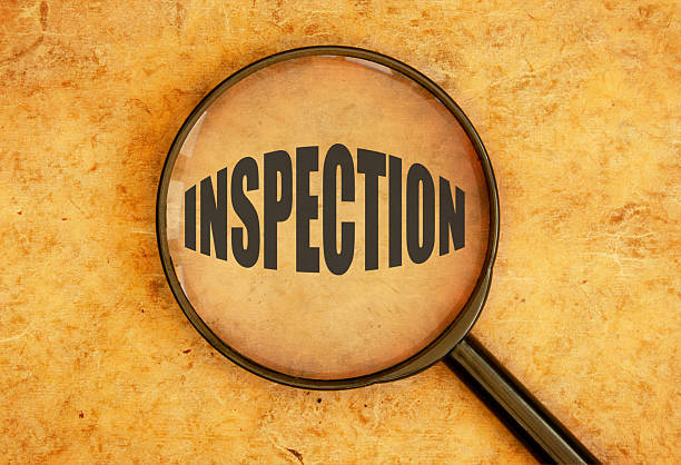 istock Inspection with yellow background 469943287
