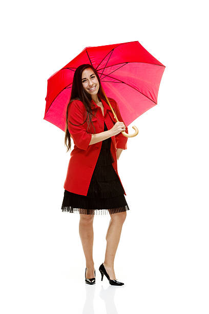 istock Smiling woman holding umbrella 469943937
