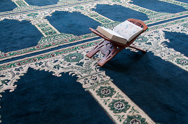 Quran standing on a stand in the mosque Quran standing on a stand in the mosque. Cape Town, South Africa malay quarter photos stock pictures, royalty-free photos & images