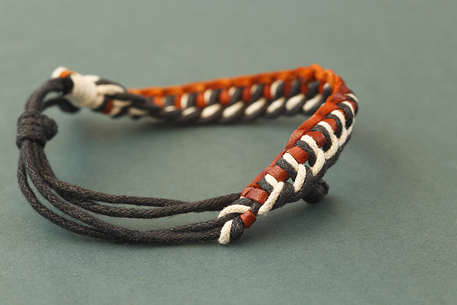 Bracelet from rope and leather close up photography.