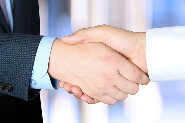istock Close-up image of a firm handshake between two colleagues outside 469947382