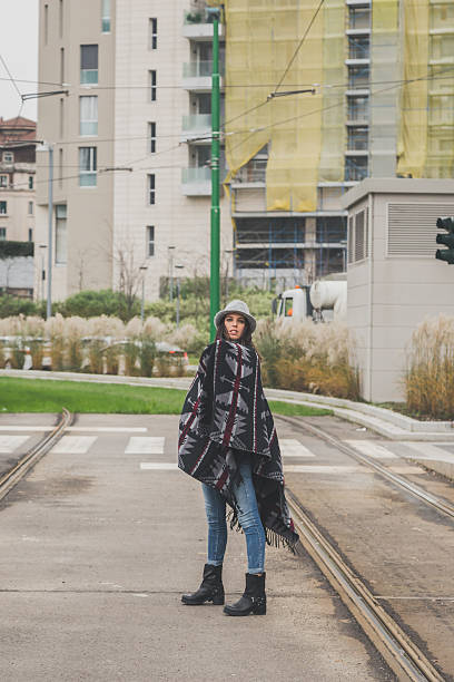 istock Beautiful young brunette posing in the city streets 469947514
