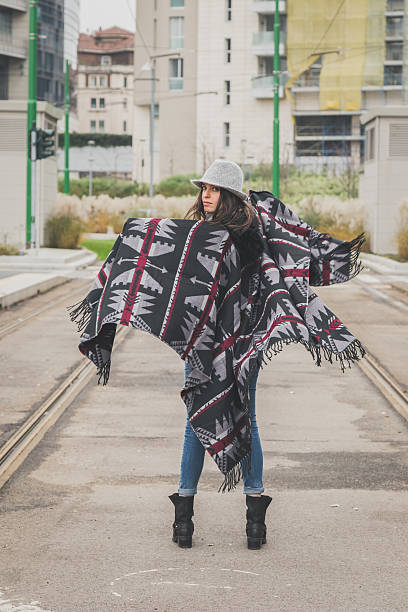 istock Beautiful young brunette posing in the city streets 469947542