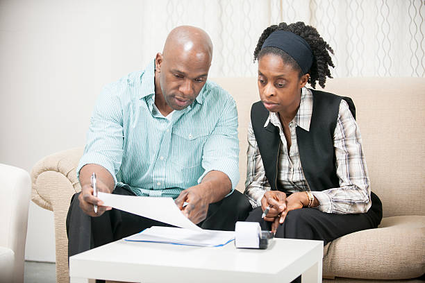 istock Husband and Wife going over Bills 469948988