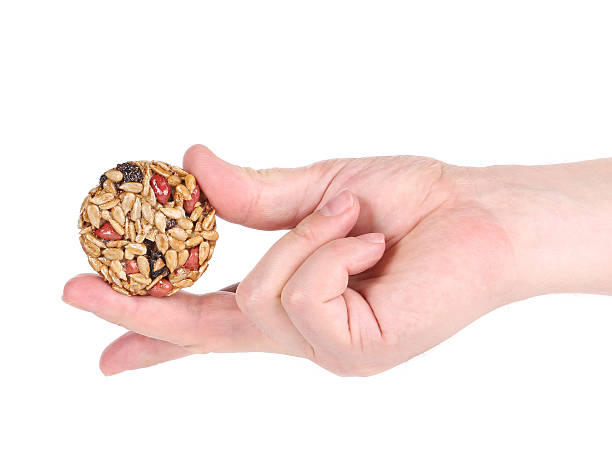 istock Honey bar with sunflower seed in hand 469949031