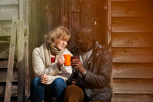 istock Mature Couple enjoying hot drinks outdoors 469951069