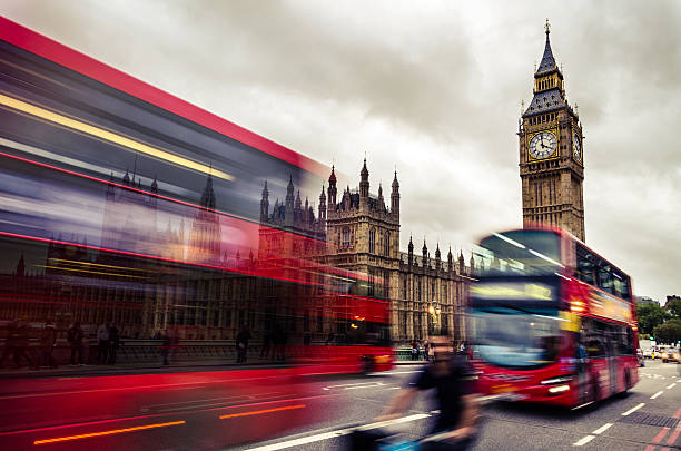 istock Many London Double Decker Bus Near Big Ben Tower 469951165