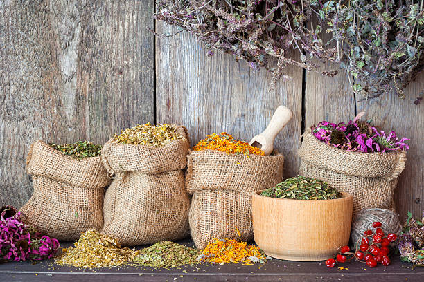 istock Dried healing herbs in hessian bags and mortar 469956524