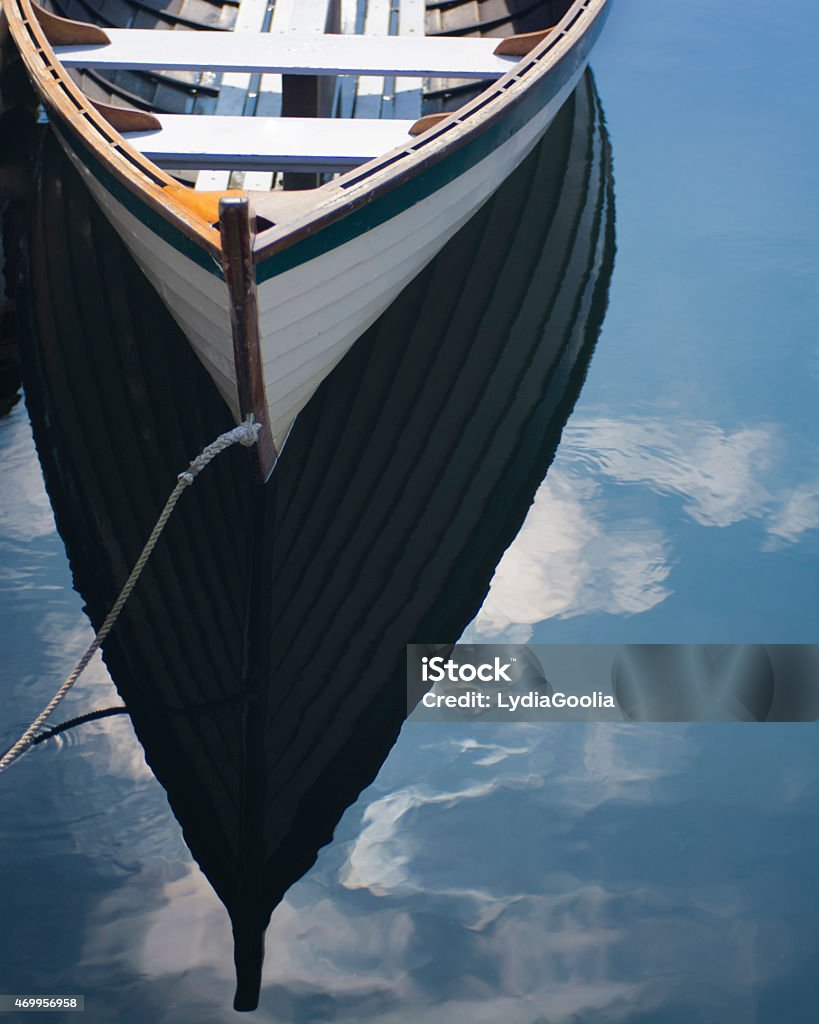 Rowboat Small wooden rowboat in the water 2015 Stock Photo