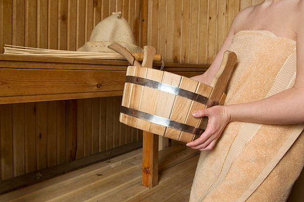 istock Beautiful woman in sauna, bath accessories 469957078