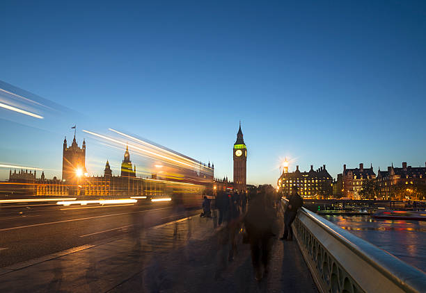istock London bus and tourists at Big Ben 469957501