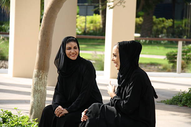 istock Emirati women talking in the park, Dubai, UAE 469958416
