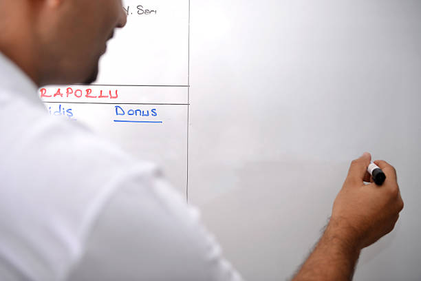 Writing on board Blank board. Man is writing on the board man writing on white board stock pictures, royalty-free photos & images