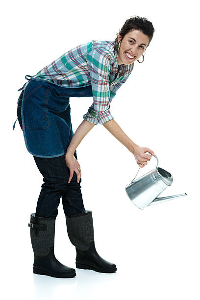 istock Cheerful farmer in action with watering can 469960215