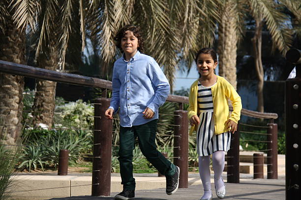istock Children running in the park, Dubai, UAE 469961296