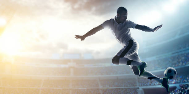 istock Soccer player kicking ball in stadium 469961434