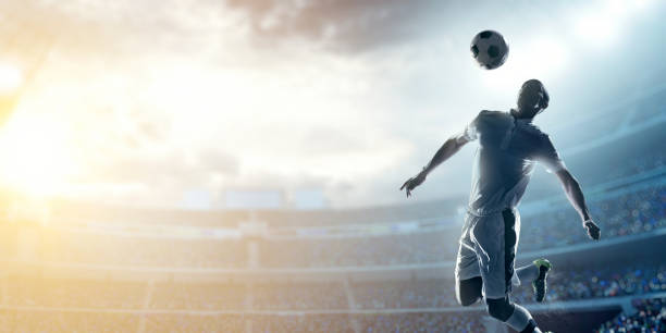 istock Soccer player kicking ball in stadium 469961438