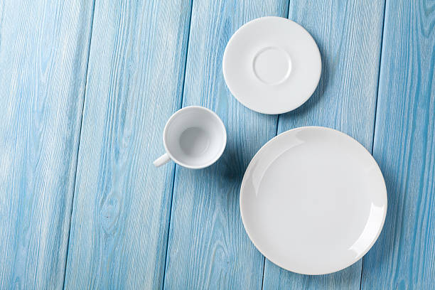 istock Empty plate and coffee cup on blue wooden background 469961506