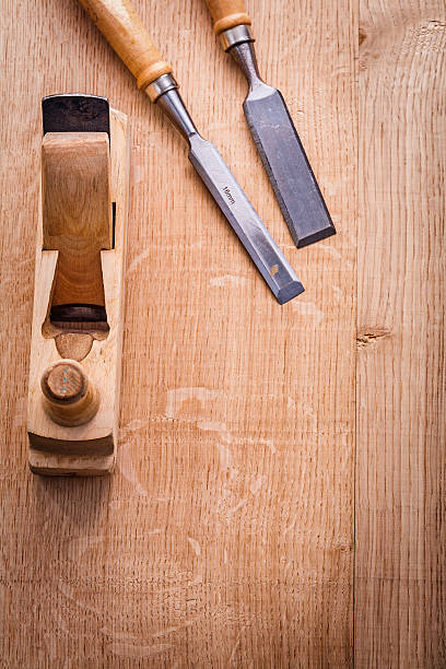istock chisels and woodworkers plane on wooden board construction conce 469961524