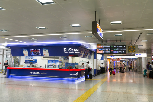 Narita, Japan - May 23, 2013 : People at the Narita Airport Station. This station is located in Narita, Chiba Prefecture, Japan. Keisei Main Line and Narita Sky Access are providing services in this station.