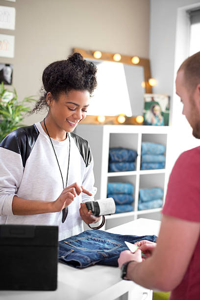 istock Clothes shop sales assistant 469963815