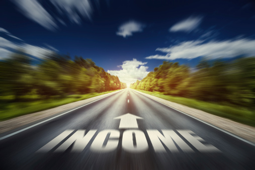 Road to income concept image. An empty asphalt road forward direction. Stock photo.