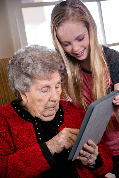 istock Elderly Woman, Girl and Tablet 469966479