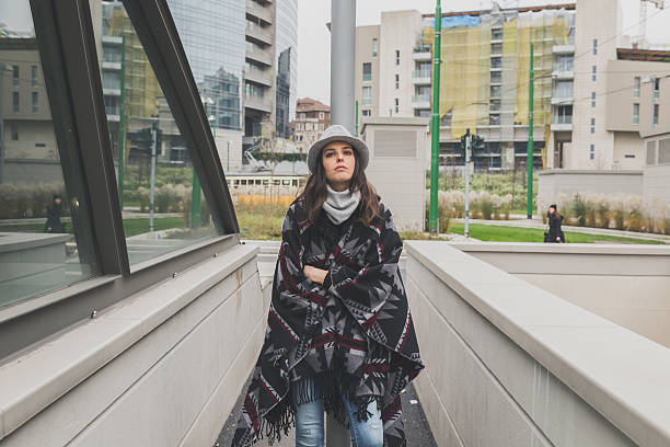 istock Beautiful young brunette posing in the city streets 469967402