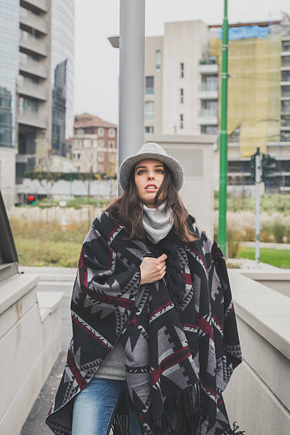 istock Beautiful young brunette posing in the city streets 469967430