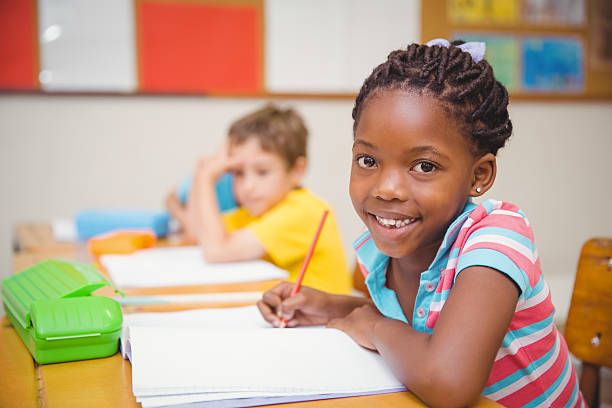 istock Cute pupils drawing at their desks 469967754
